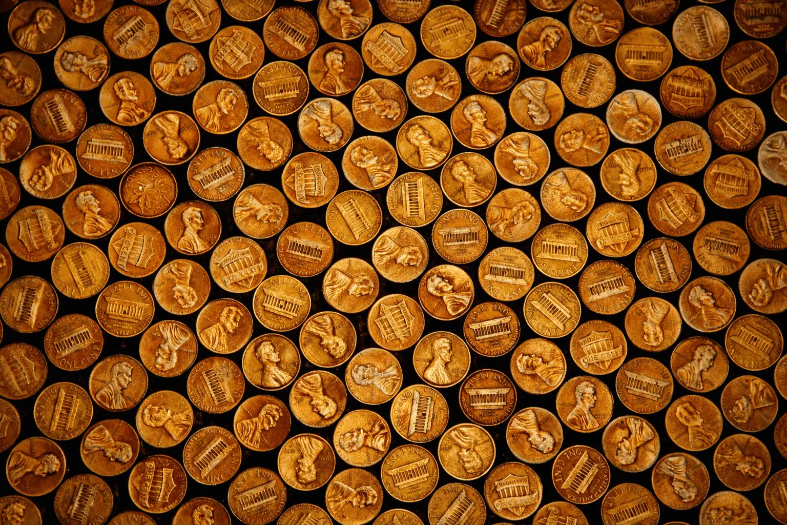 Overhead close-up of many copper Lincoln pennies