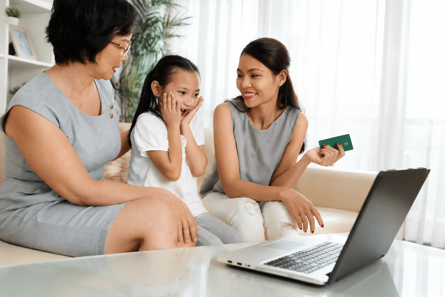 Mom, daughter and grandmother sitting together