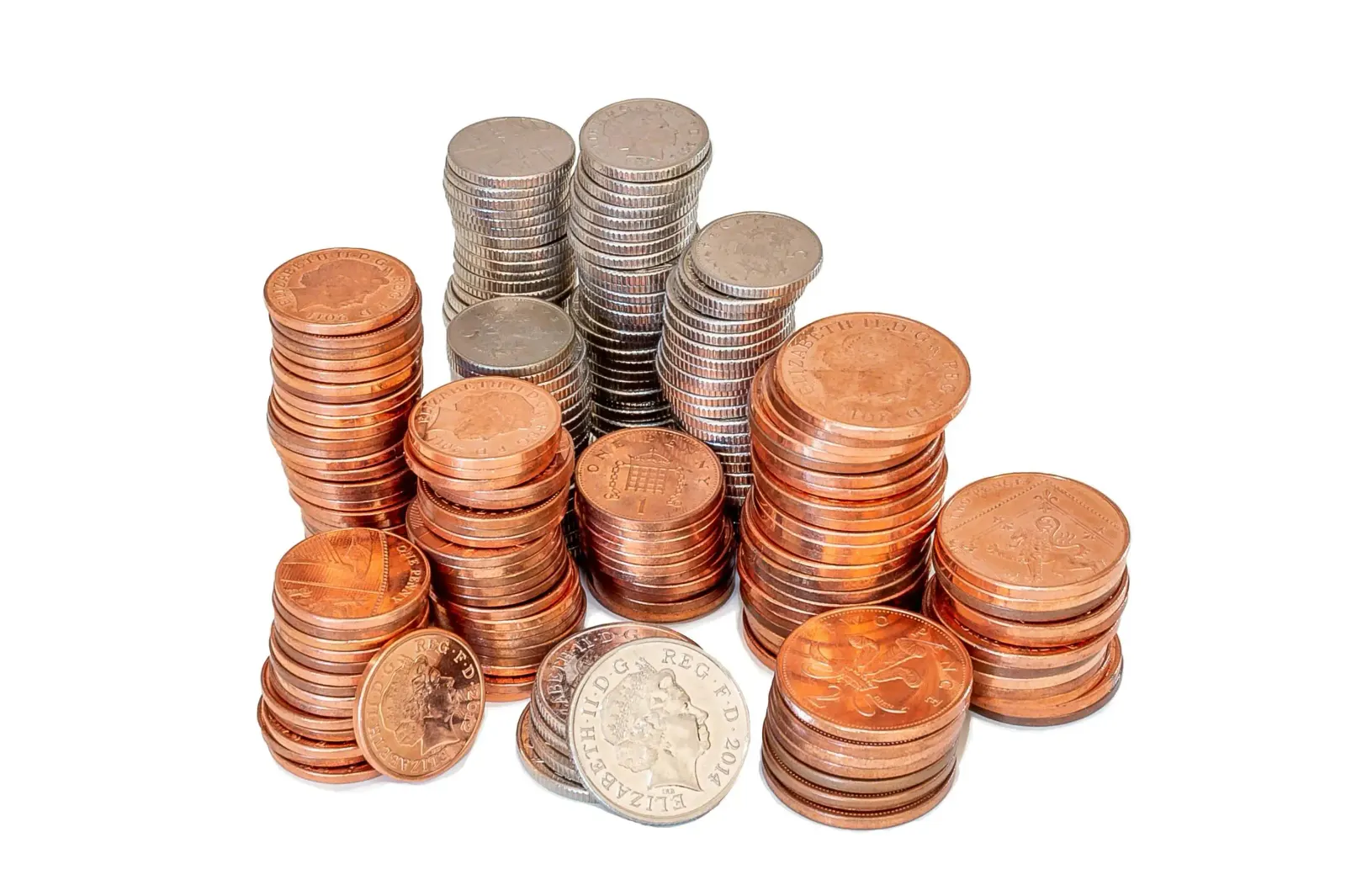 stacks of British copper and silver coins arranged in columns