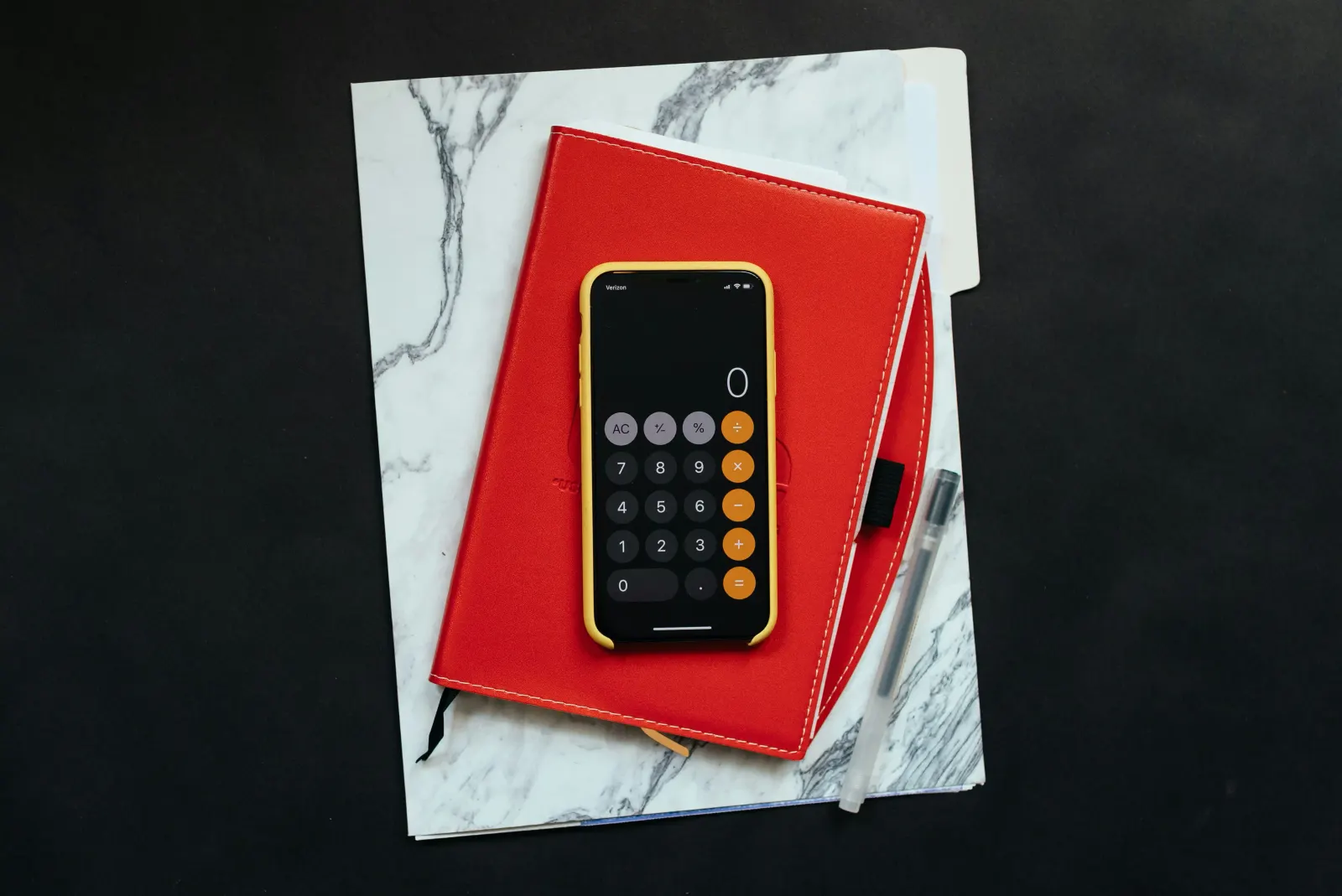 Book and calculator over a table