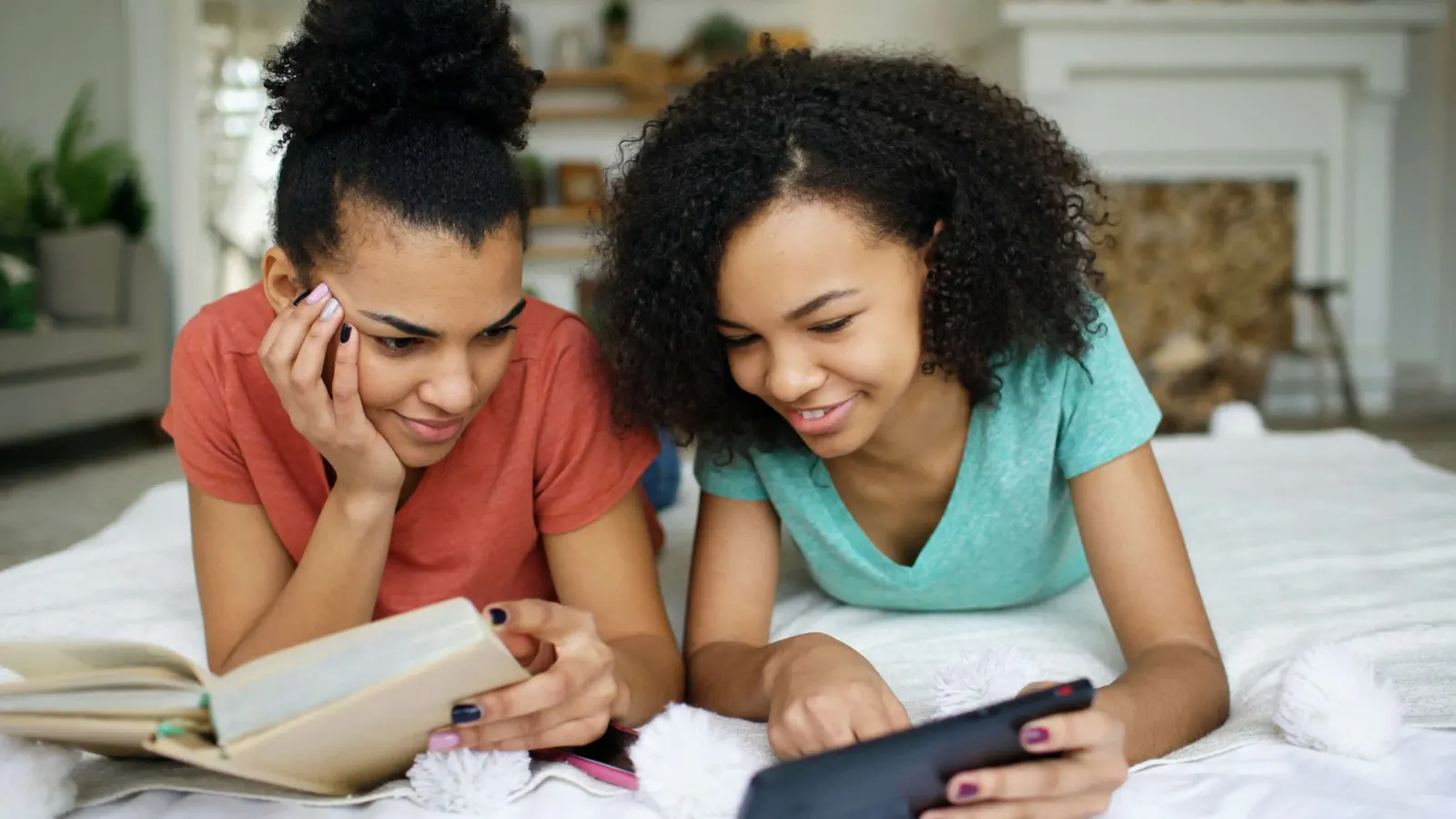 Two girls using a phone