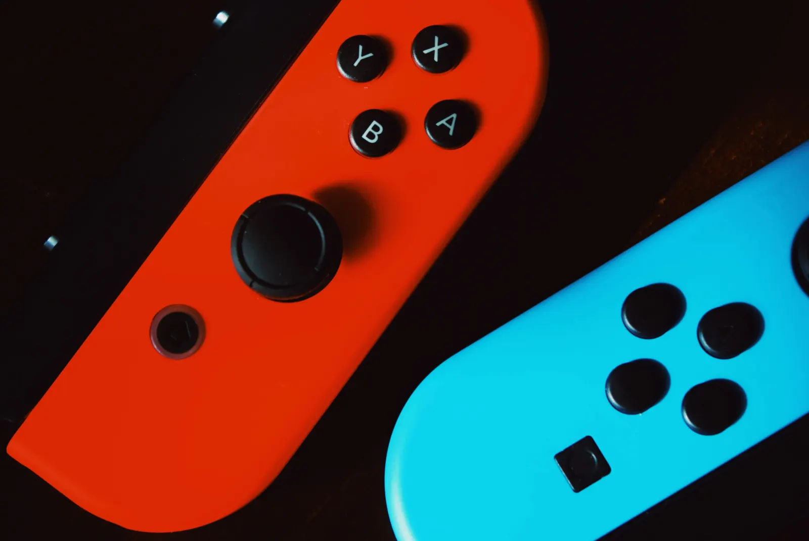Close-up of red and blue Nintendo Switch Joy-Con controllers