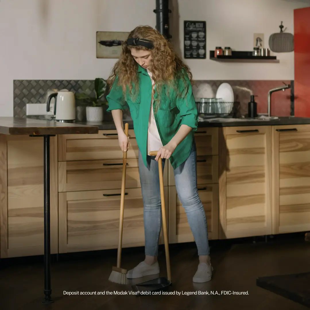 Teenage Girl Sweeping The Floor