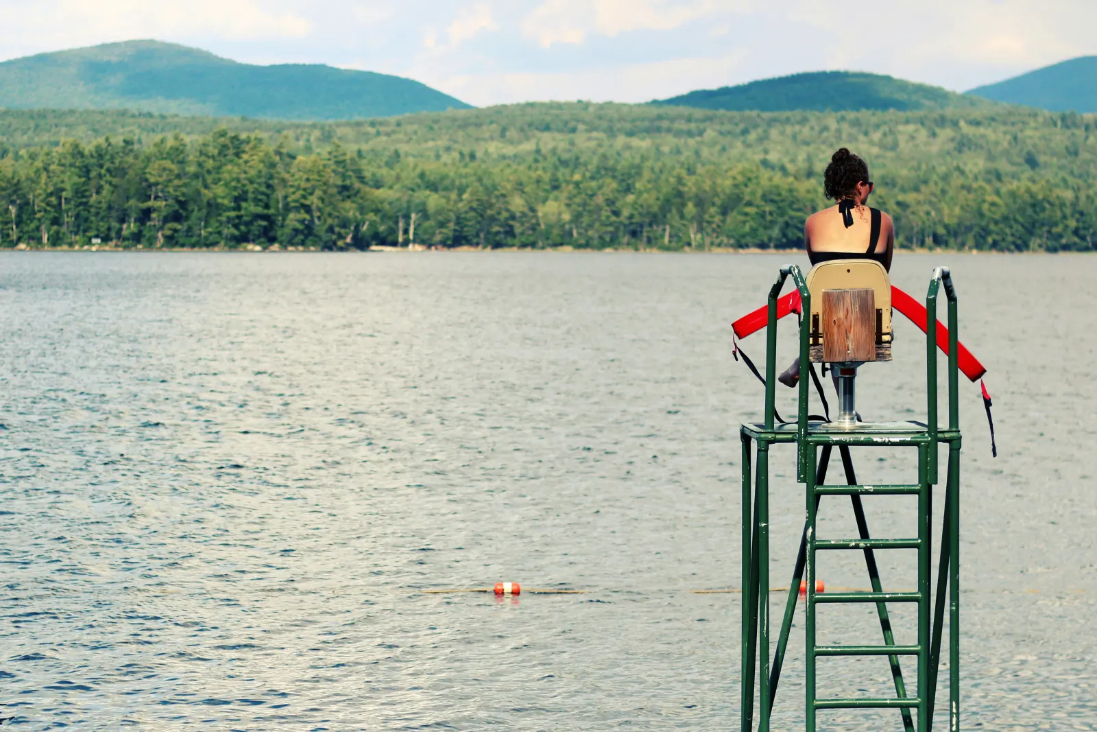 Girl lifeguarding at a lake