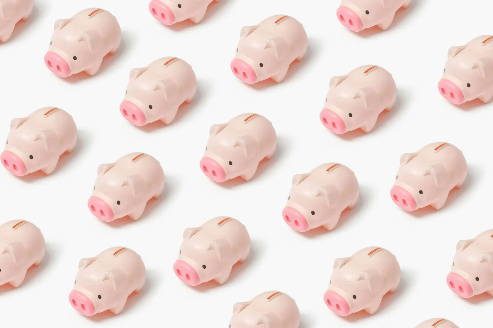 repeating pattern of small pink piggy banks on a white background