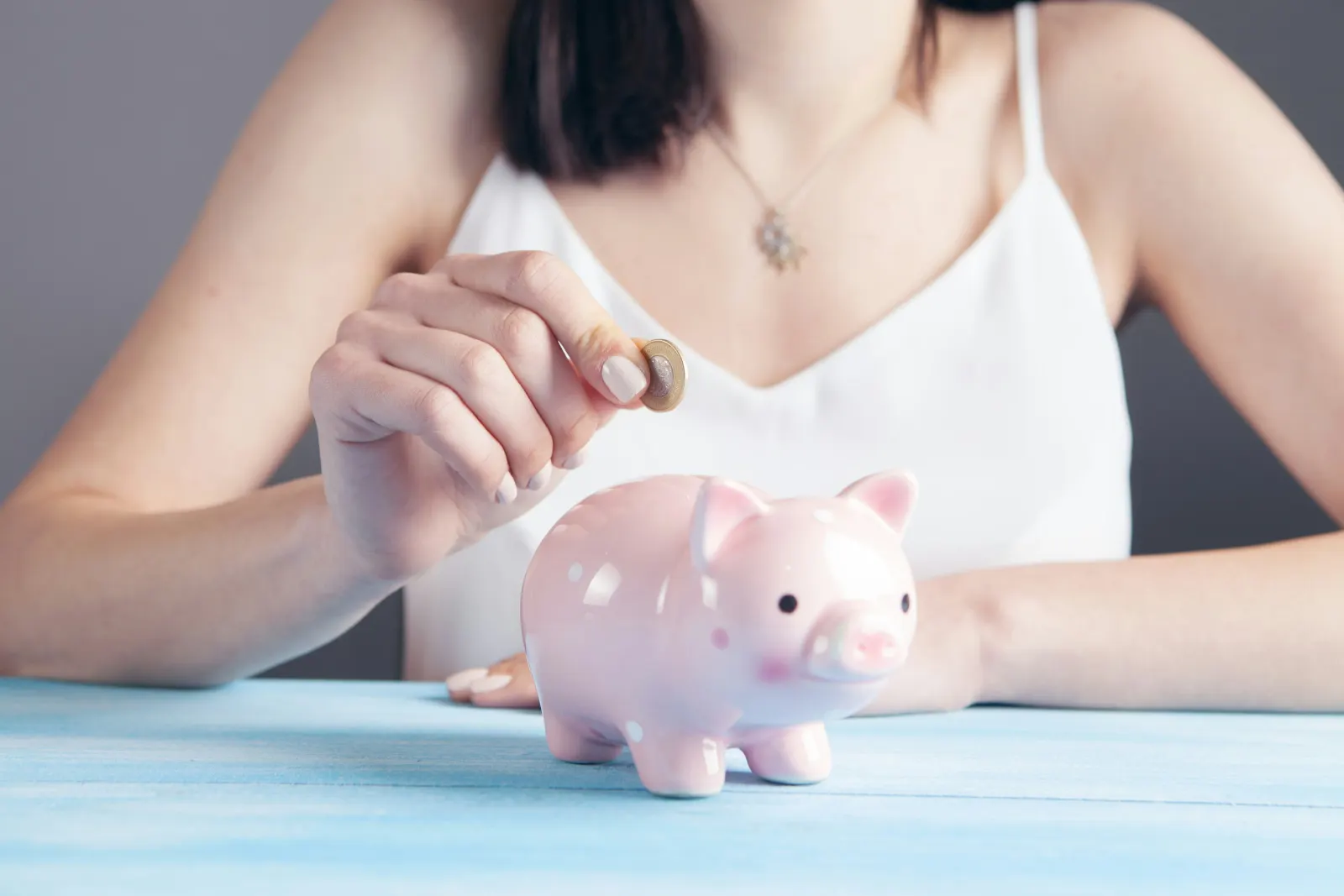 Classic piggy bank with coin