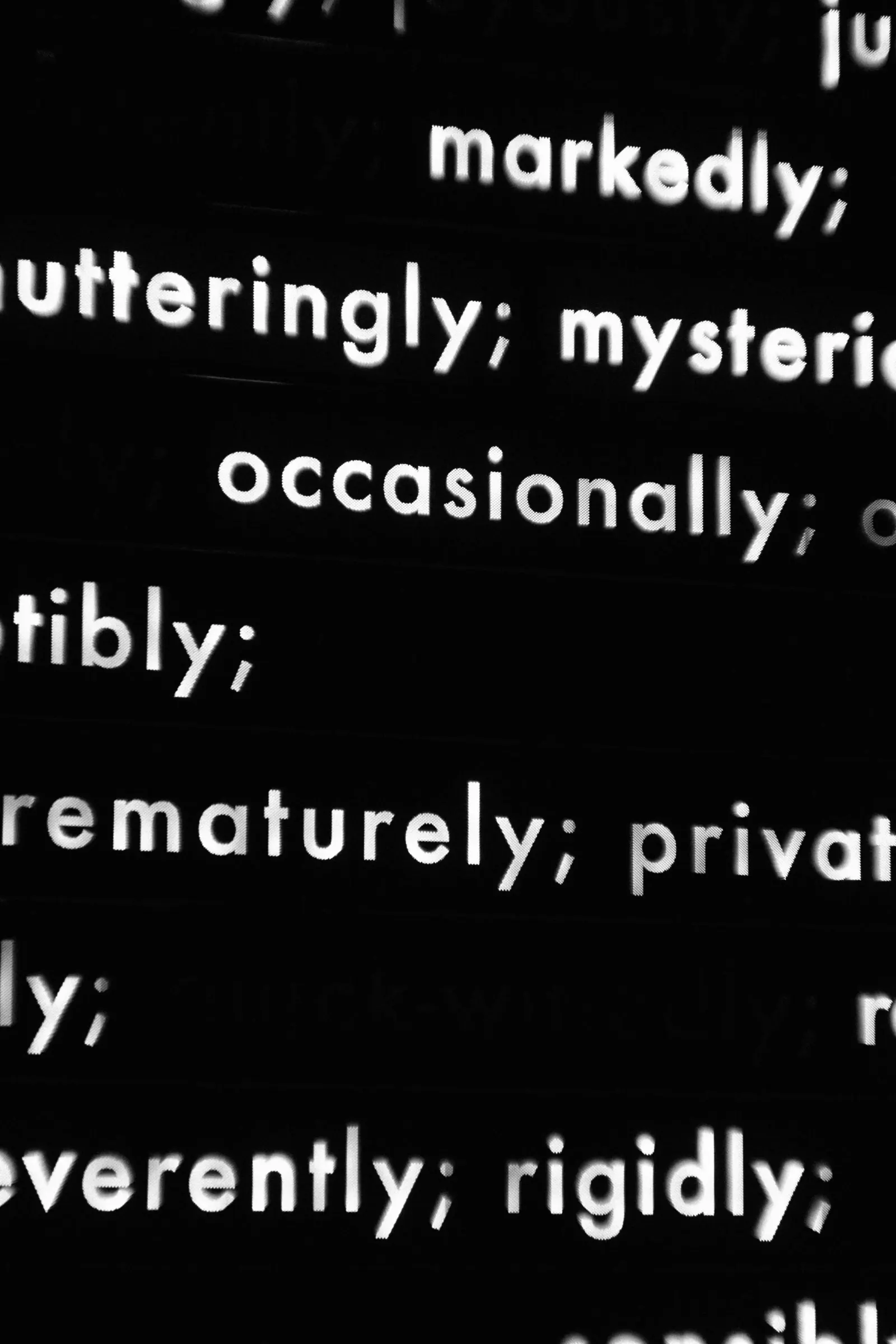 Adverbs like markedly and occasionally in white text on black