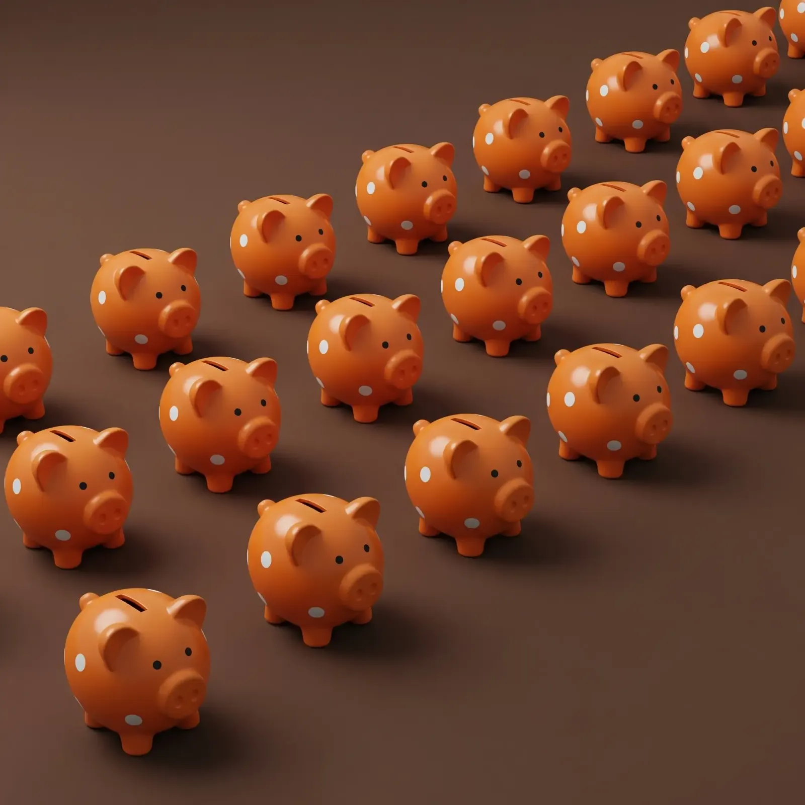 Rows of orange polka-dot piggy banks arranged diagonally