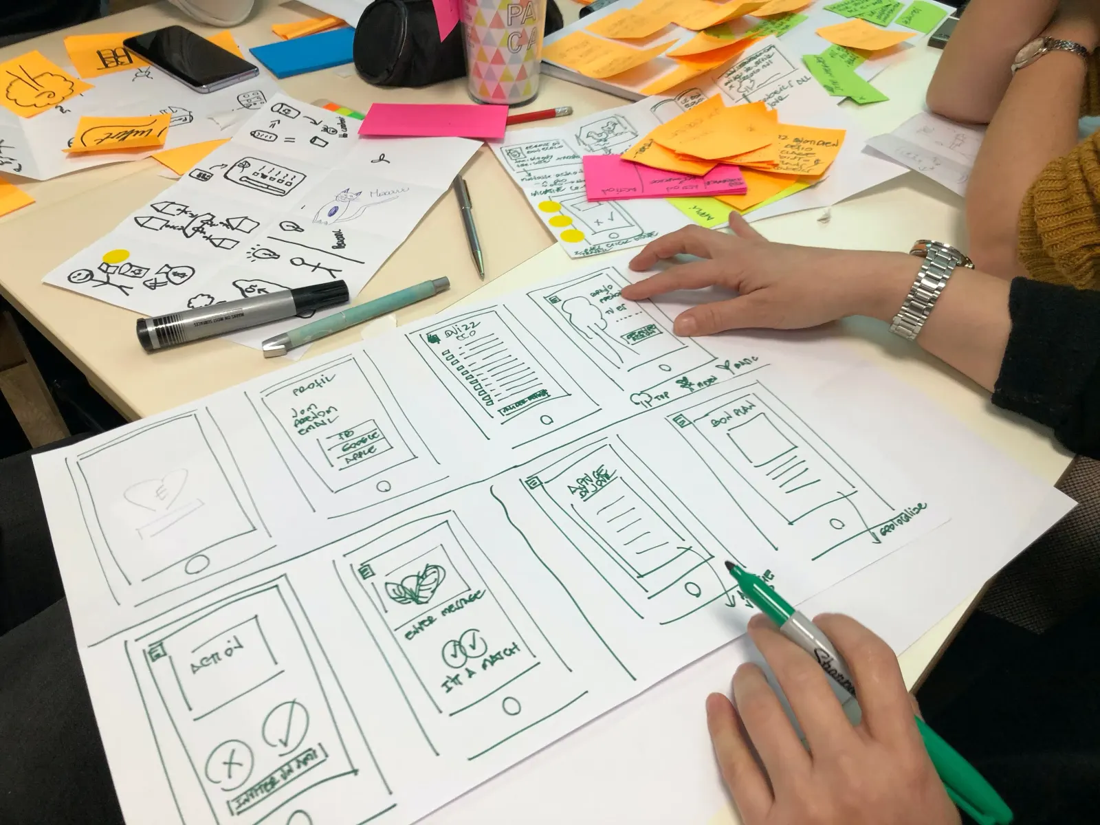 Designers sketching a new product feature