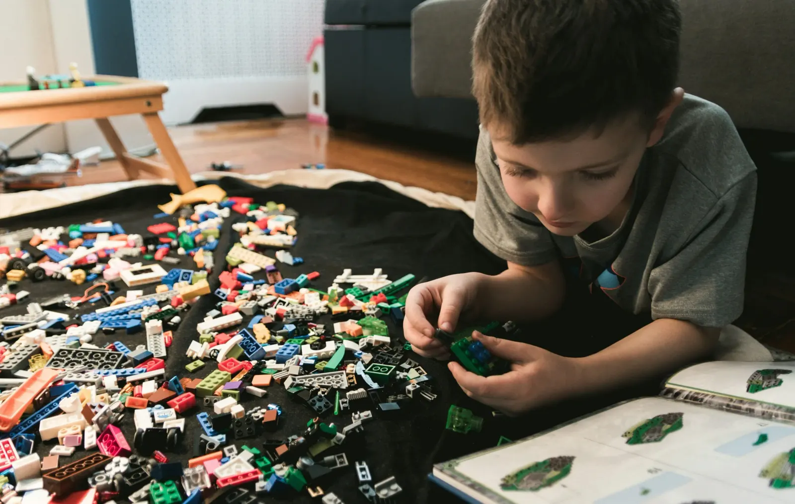 Boy playing with is toys
