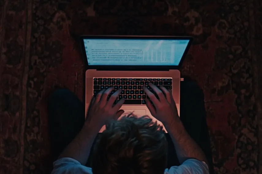 A man writing a cover letter