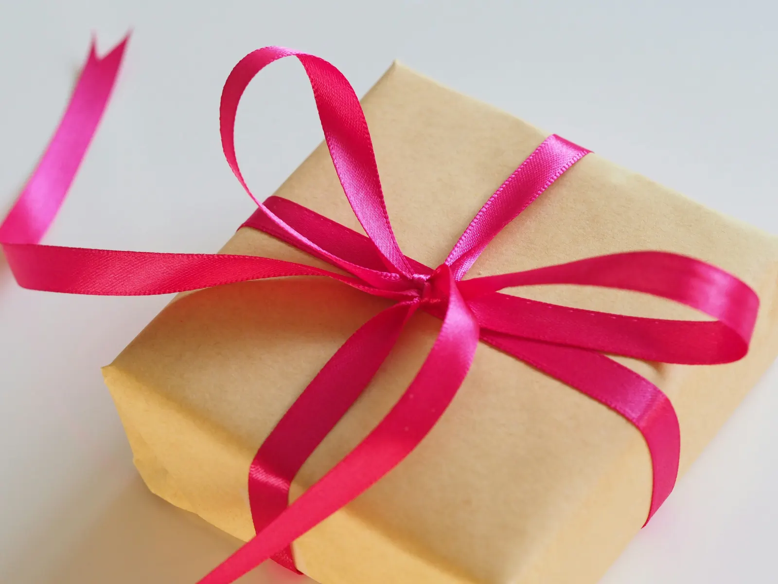 Gift tied with red ribbons