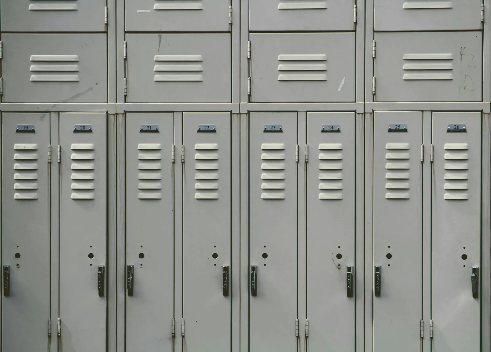 Row of gray metal school lockers numbered 19 to 26