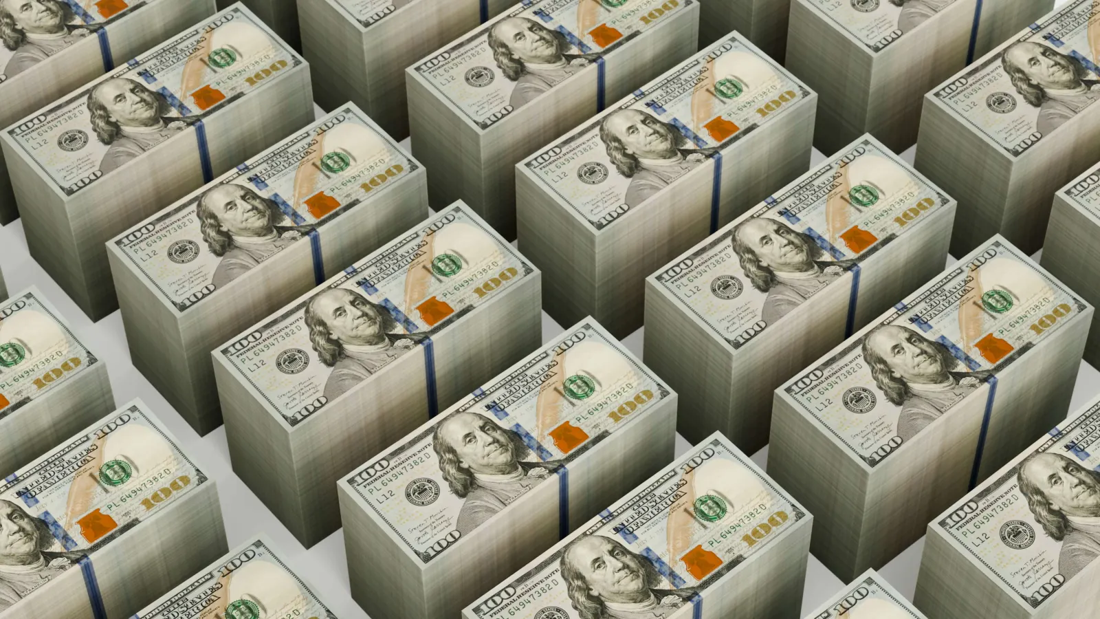 Neat rows of stacked hundred-dollar bill bundles
