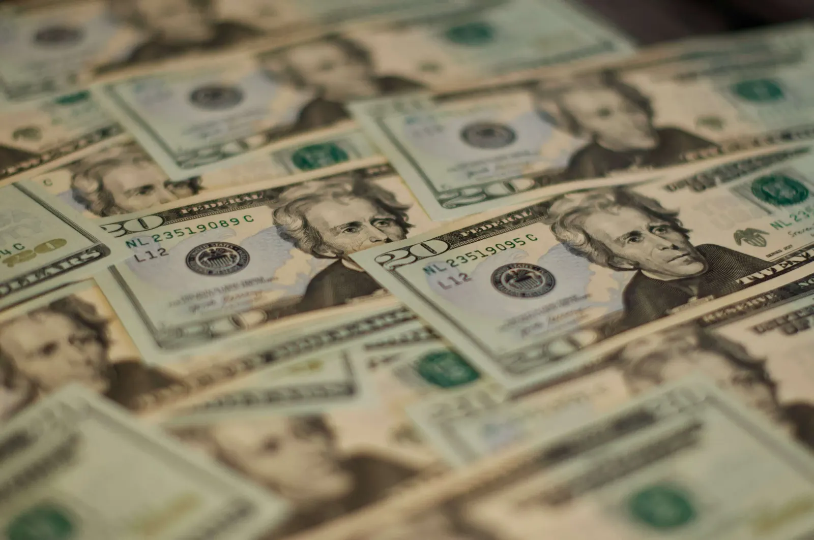 Overlapping twenty-dollar bills featuring Andrew Jackson's portrait